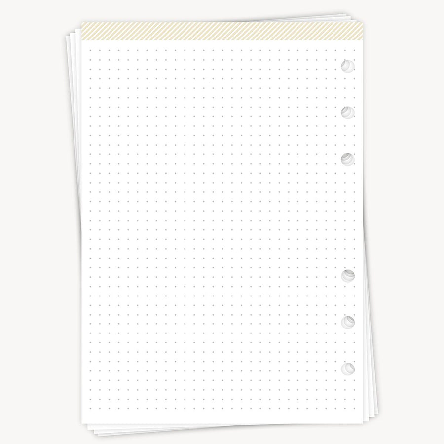 White notebook with dot grid on a white background