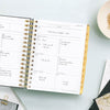 Day Designer 2026 weekly planner: black stripe opened with writing on it